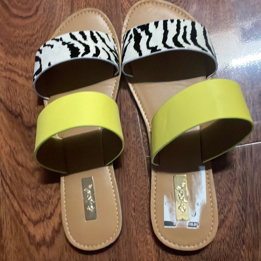 Size 7.5 sandals from Qupid. Brown with a yellow strap and a cow print strap.